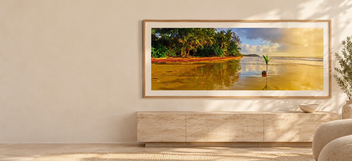 Sun-Kissed panoramic photograph in a natural oak frame on a sunlit gallery wall