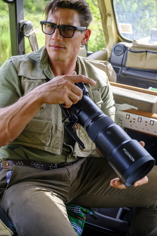 Mitchell Burns in the field with a Fujifilm camera and FUJINON telephoto lens