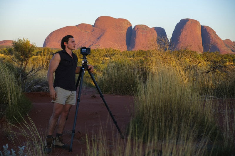 Mitchell Burns photographing at Kata Tjuta in the Northern Territory