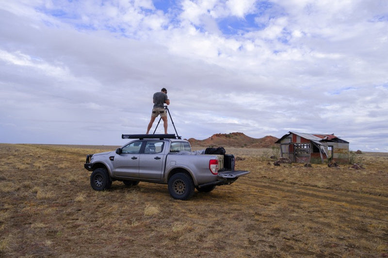 Mitchell Burns photographing from a Ford Ranger in the Australian outback
